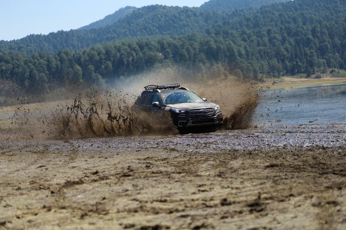 Subaru Outback on a dirt road — a reliable pre-owned crossover