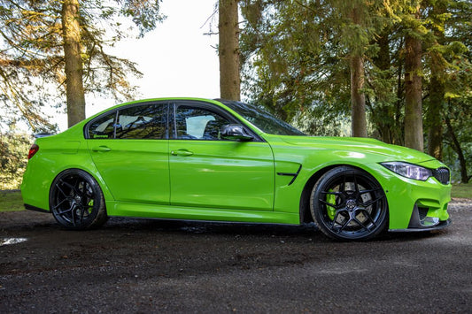 BMW F80 M3 sedan parked on a road — F8X M3/M4 brake upgrade guide