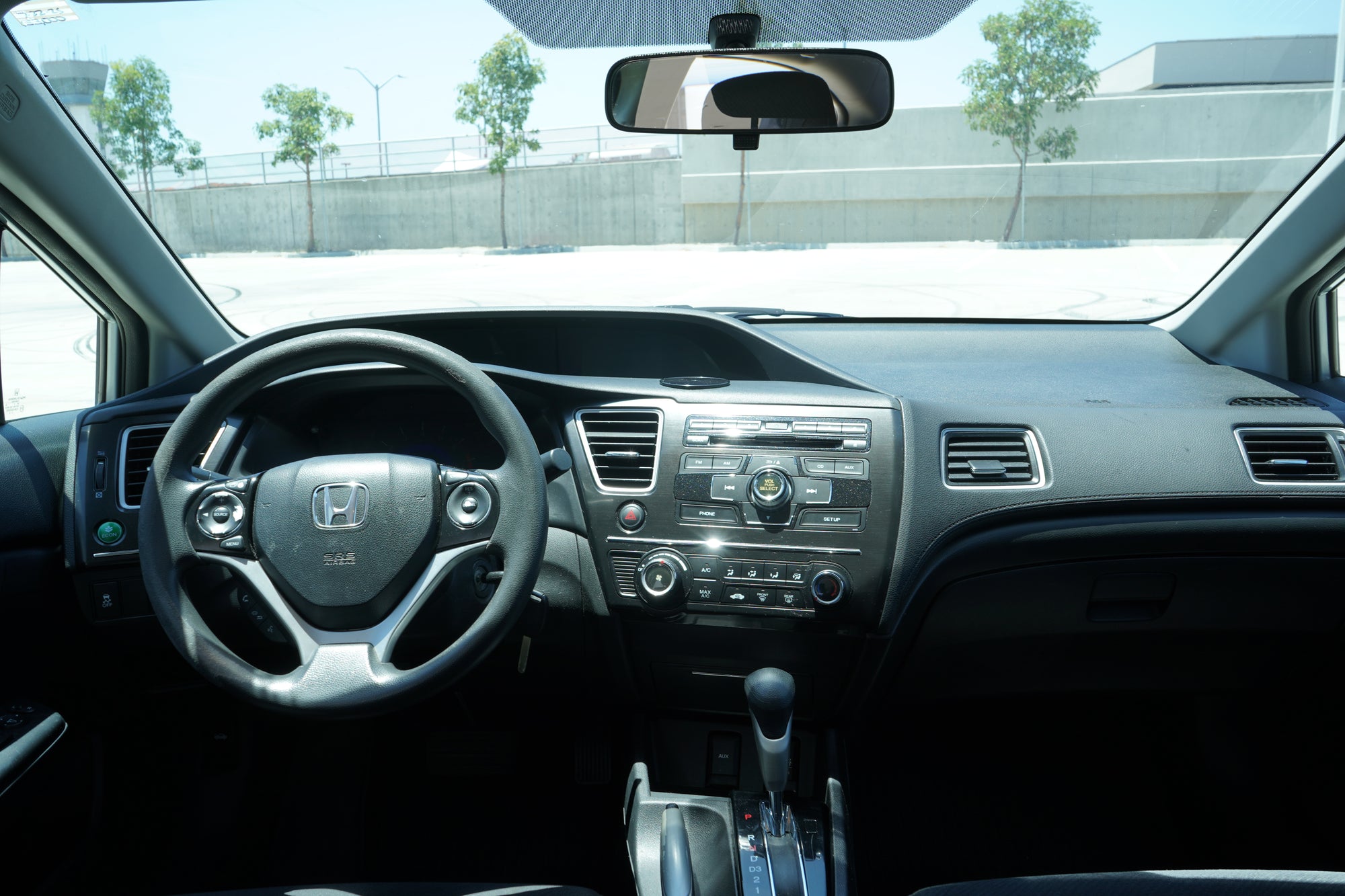 2013 Honda Civic LX silver sedan driver side profile - Iconic Garage Burbank CA