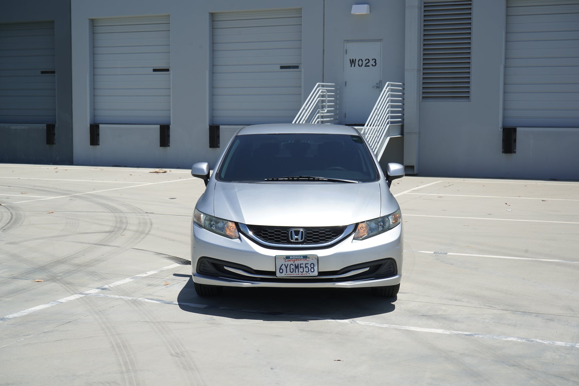 2013 Honda Civic LX silver sedan front exterior - Iconic Garage Burbank CA