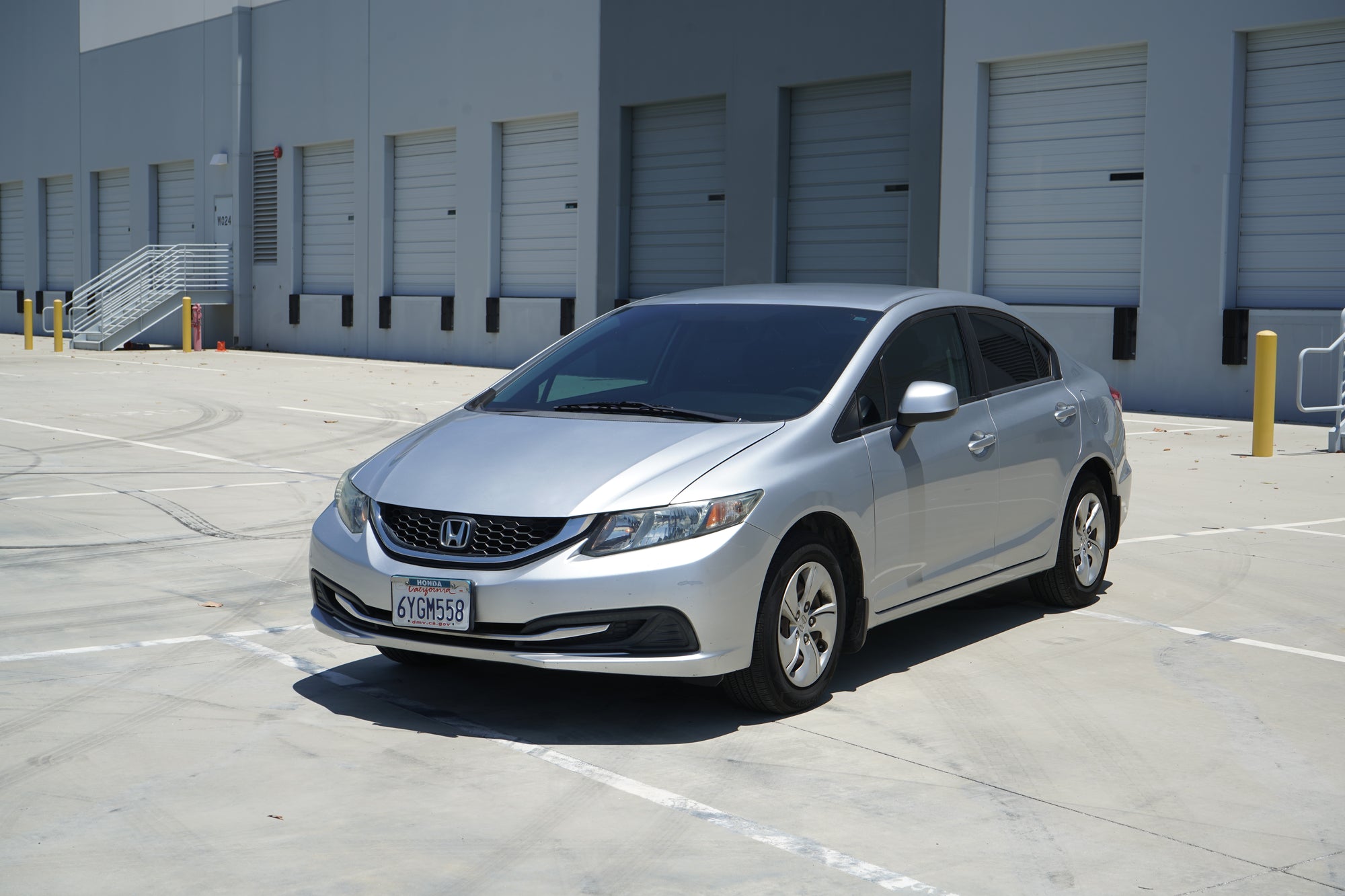 2013 Honda Civic LX silver sedan rear exterior - Iconic Garage Burbank CA