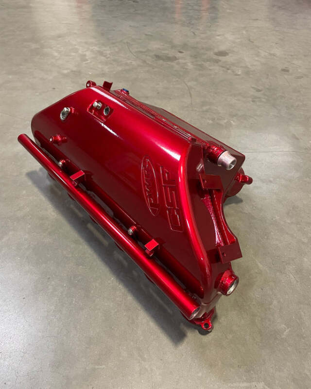csf bmw m2/m3/m4 s58 (g8x) charge-air cooler manifold - candy apple red bmw m3 m4 g80 g82 g8x iconic garage